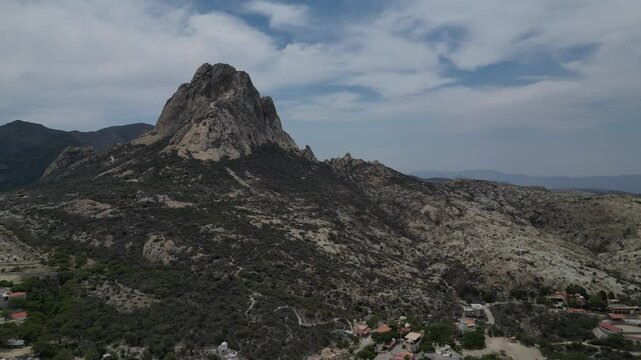 Aerial drone captures the Pena de Bernal mountain in Queretaro, Mexico.