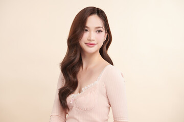 Obraz premium Beautiful young asian woman with clean fresh skin on beige background, Face care, Facial treatment, Cosmetology, beauty and spa, Asian women portrait.