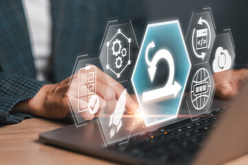 Business professional working on a laptop with scrum agile methodology icons, representing project...