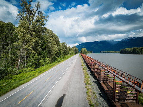 CN freight train travels alongside the Skeena River on Highway 16 between Prince George and Prince Rupert BC, Canada.