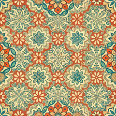A seamless pattern featuring flowers and leaves on a vibrant red background