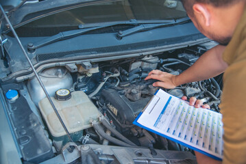 Close up Man hands fixing Car machinery vehicle mechanical service. Mechanic man hands repairing car auto repair shop. open vehicle hood checking up auto mobile. Vehicle Car maintenance engineer.