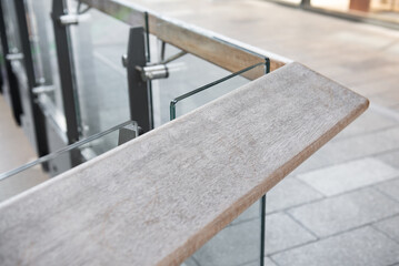 Wooden railing with tempered glass of walk way balcony.