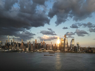 NYC, New York City Skyline with dramatic sky. American Urban Skyscrapers USA near dramatic clouds. New York City skyline, cityscape of Manhattan in USA. Panoramic view on Manhattan.