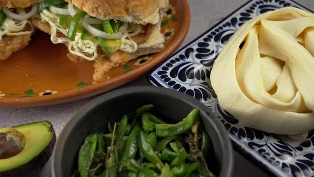 Mexican breaded steak sandwich with string cheese and chili strips