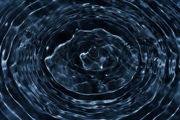 Black water with ripples on the surface. Defocus blurred transparent blue colored clear calm water...