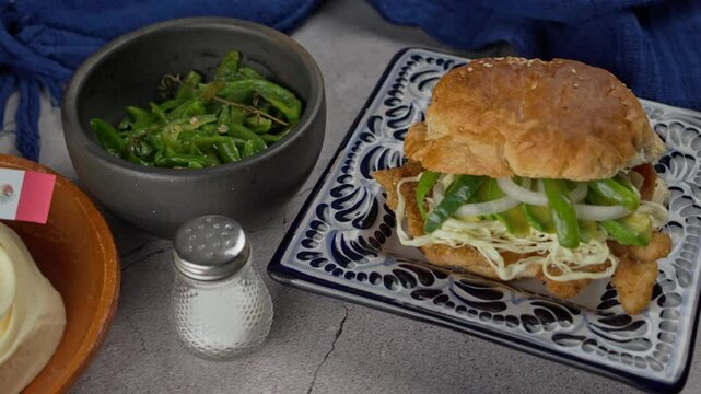 Cemita with quesillo cheese and breaded steak, Pan right