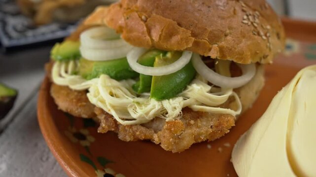 Ultra Close up shot of mexican sandwich on a talavera plate