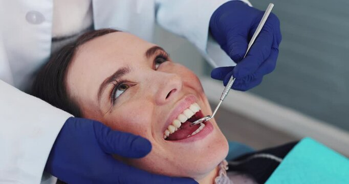 Dentist, hands and mirror in mouth for consultation, patient examination and oral inspection for routine checkup. Woman, dental tool and assessment for cleaning, procedure and teeth whitening or care