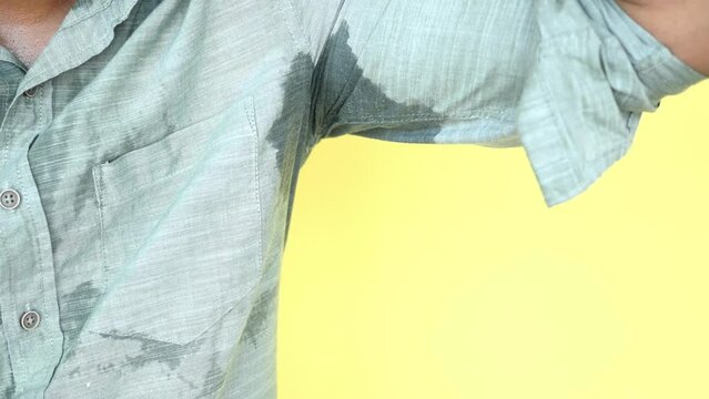 man with wet armpits Smelly odor from sweat .
