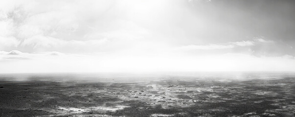 A desolate, empty beach with a cloudy sky