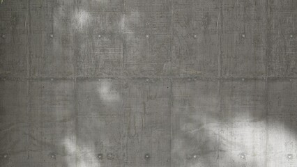 Fototapeta premium Close up of blank gray cement concrete plank wall with dapple sunlight and shadow for loft, modern product background, exterior design decoration 3D