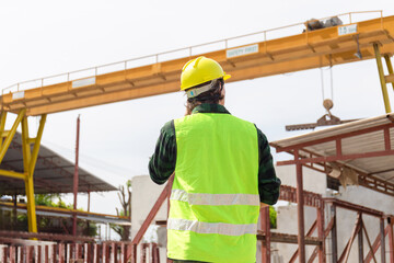 Engineer man in hardhats working at construction site, Foreman checking project at the precast concrete factory site