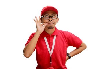 Asian delivery man or courier making a zipping mouth gesture, keeping quiet while asking to hurry about a limited special offer, discount, or free shipping delivery promo. Isolated on white background