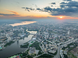 Fototapeta premium Yekaterinburg city with Buildings of Regional Government and Parliament, Dramatic Theatre, Iset Tower, Yeltsin Center, panoramic view at summer sunset.