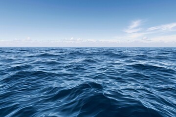 Fototapeta premium a blue ocean with waves and clouds in the sky