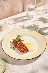 Beef Tartare with Parmesan Mousse in Sunlit Still Life Setting