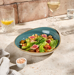 Authentic Still Life Tuna Salad with Baked Potatoes and Tomatoes in Sunlit Beige Setting