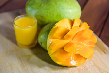 Mango juice with mango slice isolated on white background. glass of mango juice.