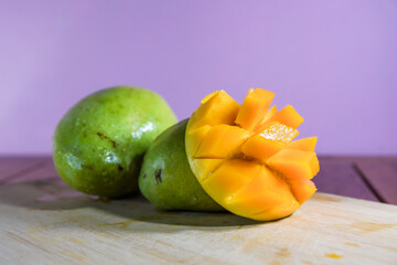 Mango Harumanis slice on wooden table background.