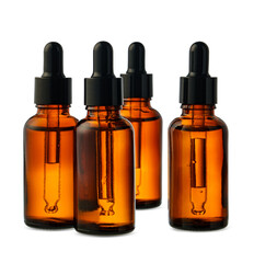 Amber Glass Dropper Bottles With Liquid Against a White Background