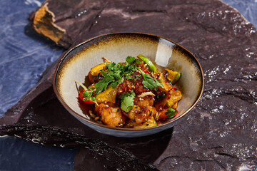 Chinese-Style Sweet and Sour Chicken with Vegetables and Cilantro Garnish
