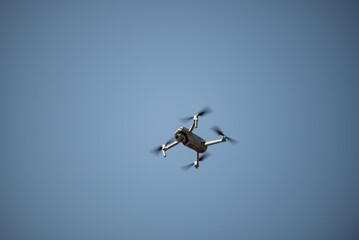 Drone quadcopter for shooting video and photography flies in the sky
