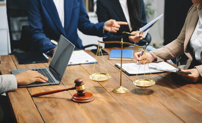 business people and lawyers discussing contract papers sitting at the table. Concepts of law, advice, legal services.