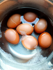 Cooked chicken eggs are boiled in a cooking pot