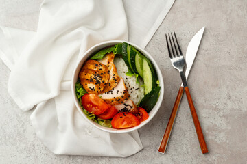 Tasty poke bowls on gray textured surface