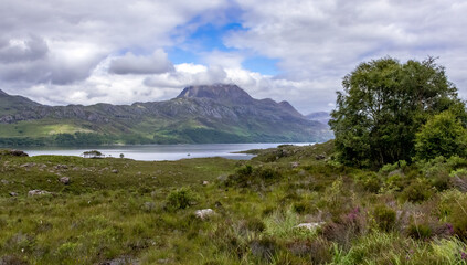 The mountain range of Slioch with cloud over the summit across Loch Maree