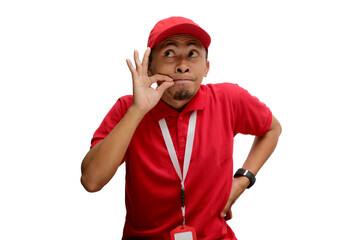 Asian delivery man is gesturing for silence by mimicking a zipped mouth, indicating a promise to...
