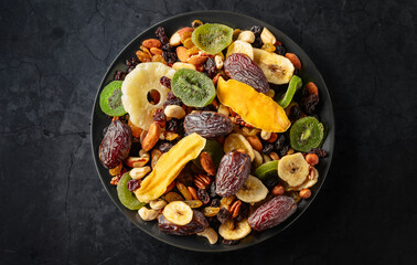 Dried tropical fruits with various nuts and raisins.