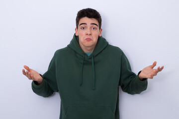 isolated teenager boy with expression of incomprehension or surprise
