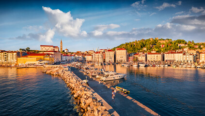 Warm sunlight glowing of Adriatic coast with beautiful Venetian architecture. Stunning morning...