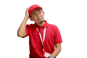 Confused Asian delivery man or courier scratching his head, thinking about something and having no clue. Isolated on a white background.