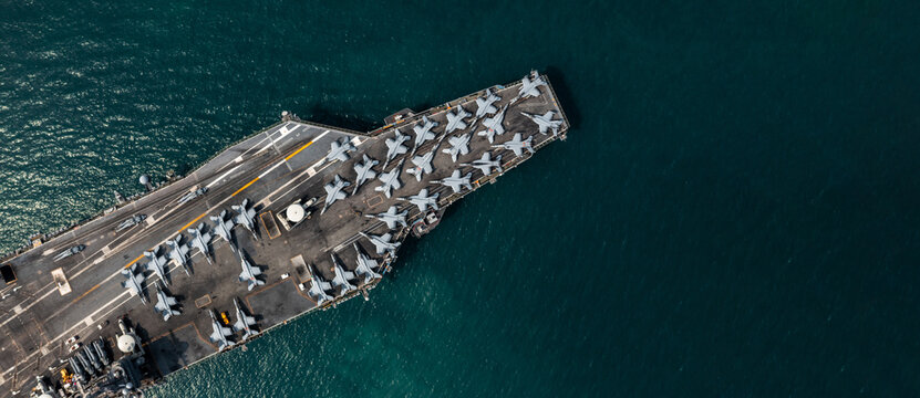 Aerial view military nuclear ship navy ship carrier full loading fighter jet aircraft, Aircraft carrier nuclear warship battleship, Military nuclear ship on the ocean.