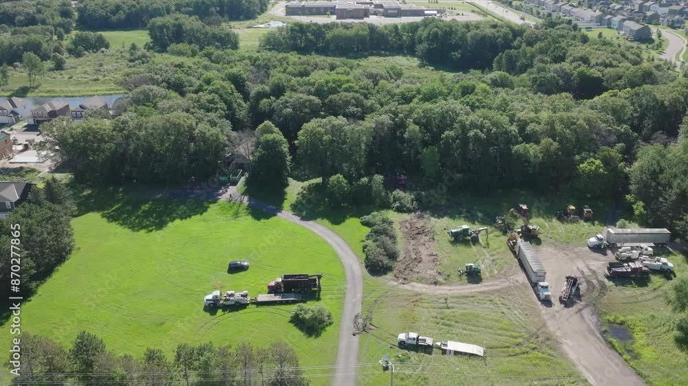Poster drone shot capturing deforestation process going on in a forest for urbanisation.