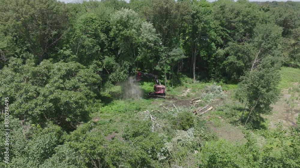 Poster rotating drone view of automated machines cutting trees and destroying the nature.