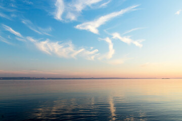 Naklejka premium Beautiful sky-water summer landscape on an evening June day in Karelia, the time of white nights.