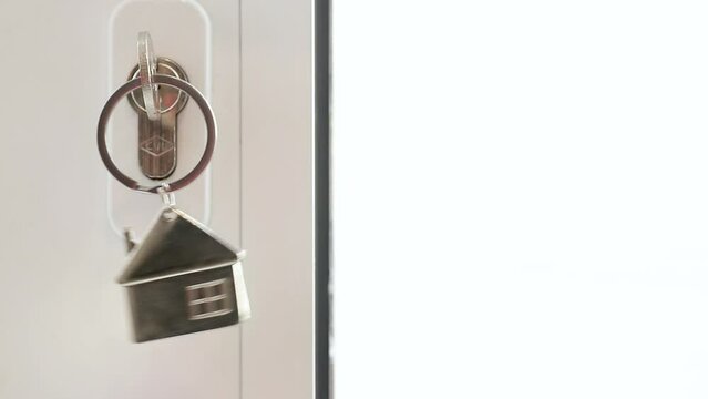 keychain swinging on door lock with copy-space
