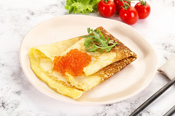 Russian pancake with red caviar