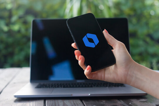 Rovo logo, collaboration tool designed by Atlassian for remote teams, offering chat, video calls, and project management features, displayed on iPhone screen