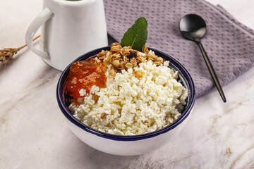 Curd with granola and orange jam