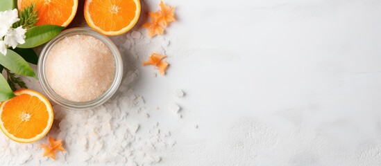 Natural body care banner featuring a body scrub with orange and sea salt, arranged in a flat lay with copy space image.
