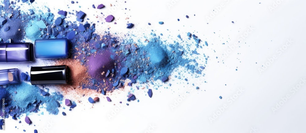 Poster background image for makeup and cosmetics with blue-toned eyeshadow scattered on a white backdrop, f