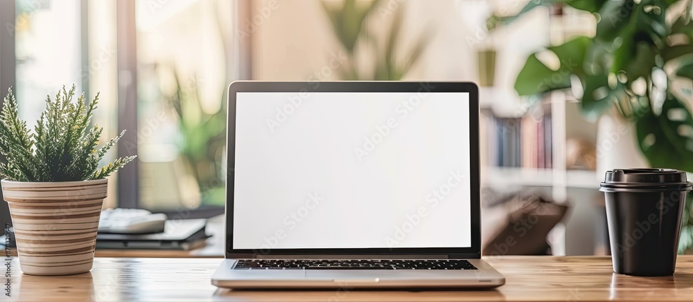 Poster laptop computer on wood desk at home, laptop with white blank on screen in work from home, home offi