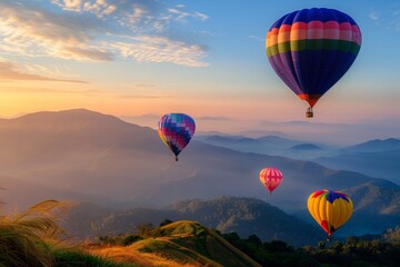 Fototapeta premium Colorful hot air balloons flying over mountain at Dot Inthanon in Chiang Mai, Thailand.
