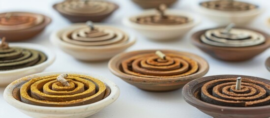 A white background showcases a variety of incense spirals made from natural ingredients with a long-lasting mild scent, ideal for meditation and worship, and offering a copy space image.