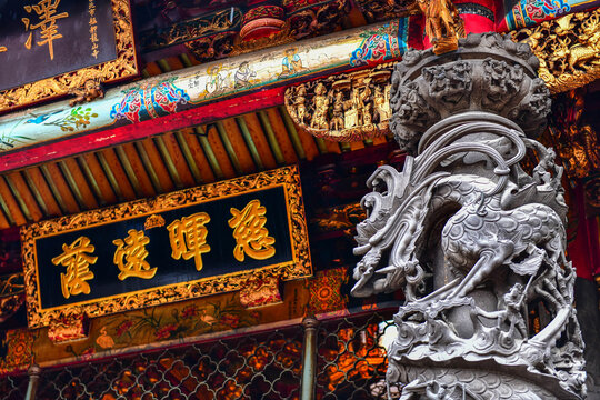 Taipei,Taiwan - Nov 19,2018 :Close up shot Dragon Stone Carving at The Gate of Lungshan Temple of Manka (a Most Beautiful Chinese folk religious temple in Taipei)